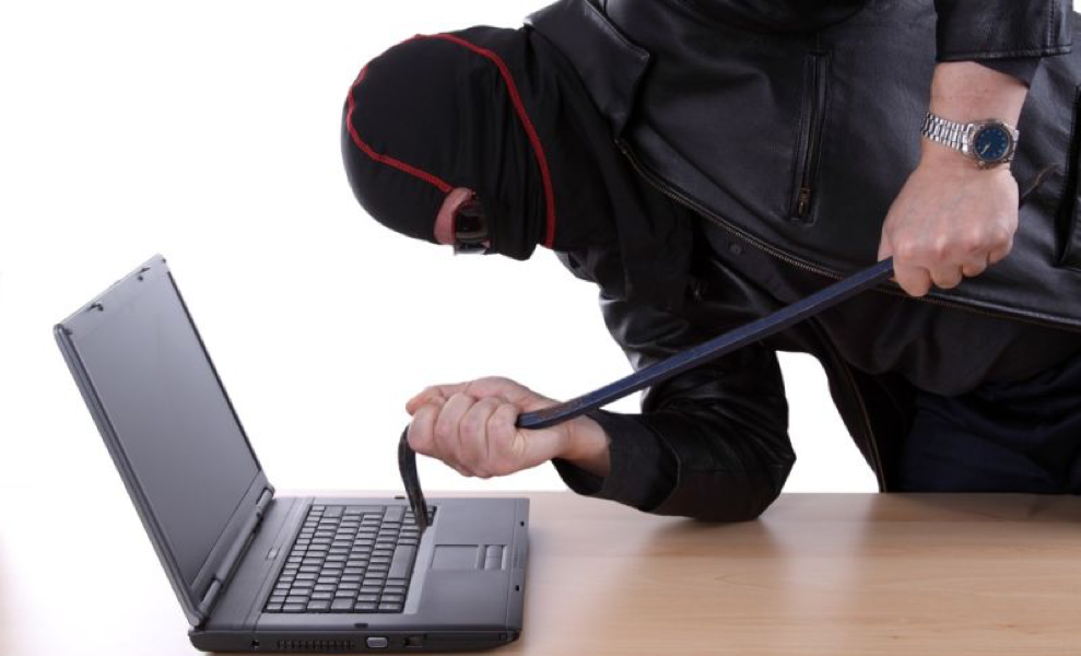 hacker attacking computer with a crowbar