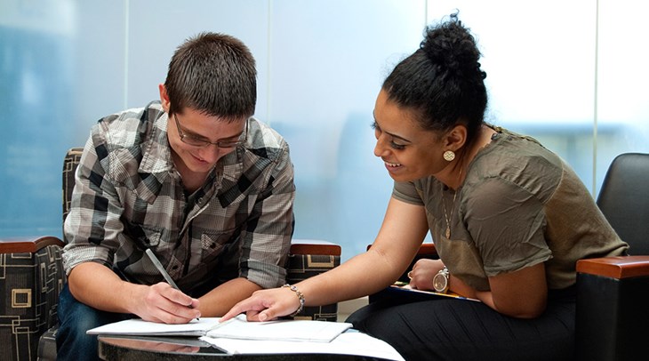 Student and counselor working on schedule