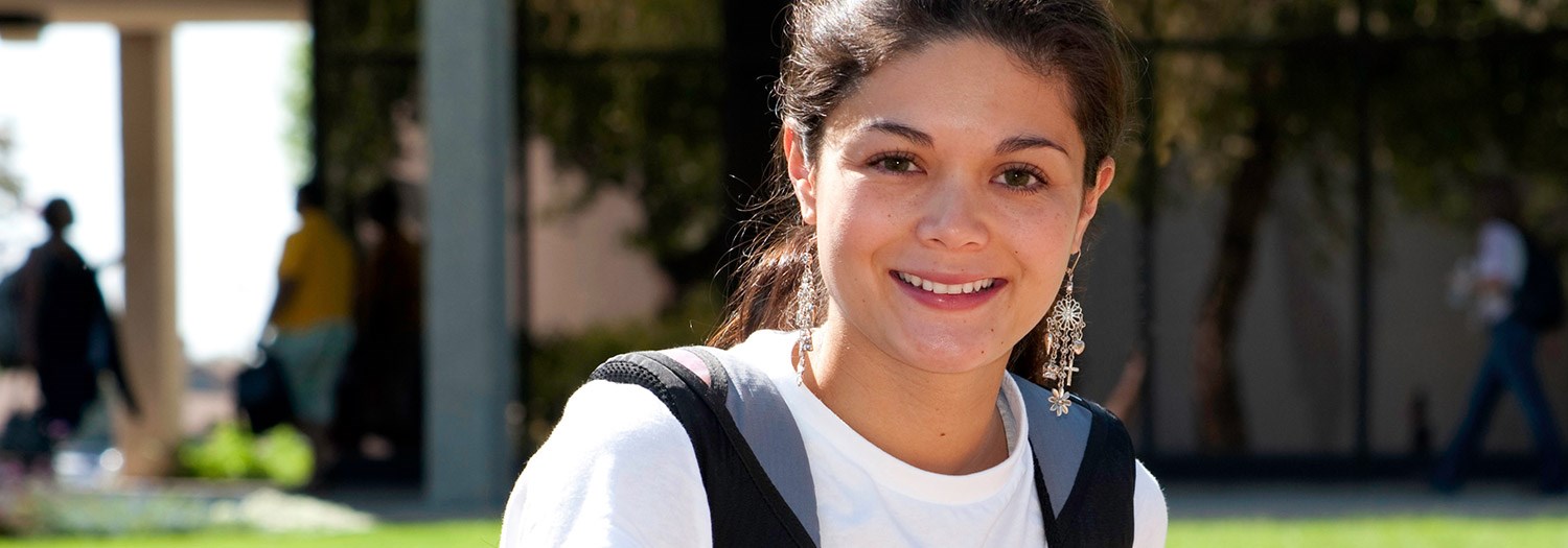 Smiling female student in an outdoor setting