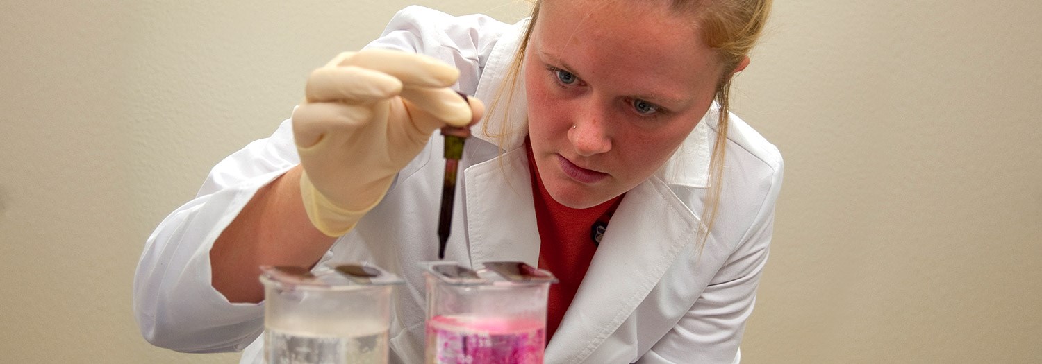 Lady working with test tubes