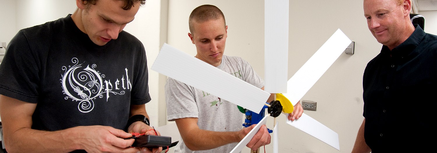 three people working on a science project