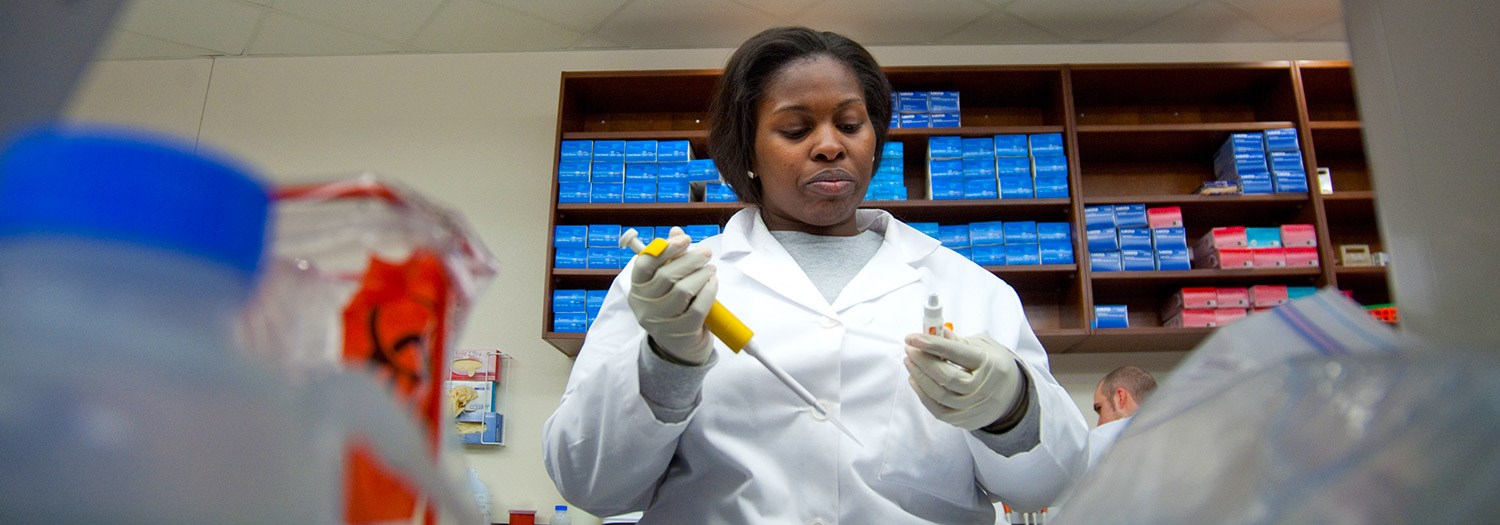 Lab worker in lab working on samples