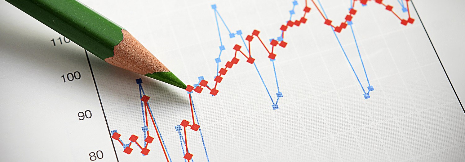 Image of a pencil and a chart showing changes in figures.