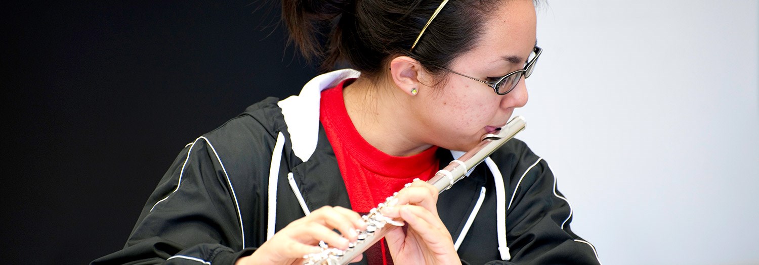 student playing flute