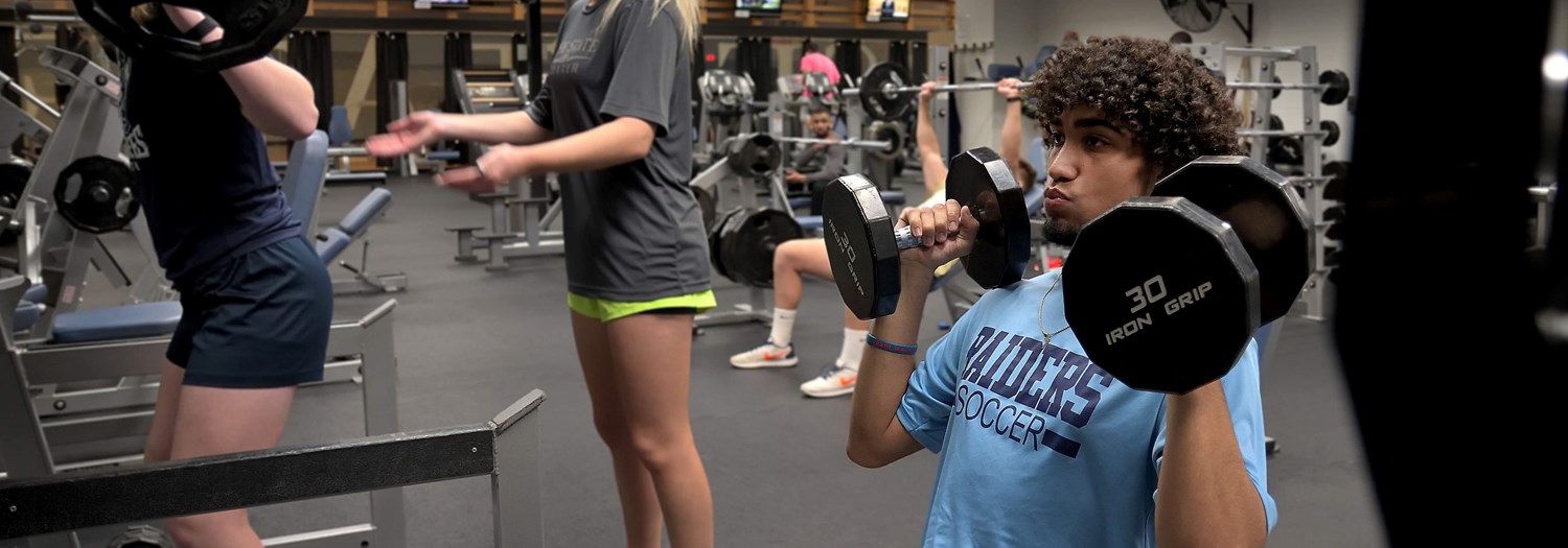 Athletic trainer working with an athlete