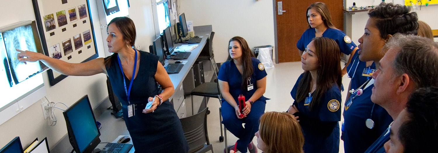 Professor and students studying xray films