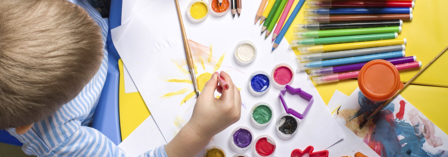 young boy painting