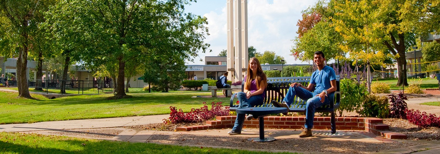 students seated in the campus mall