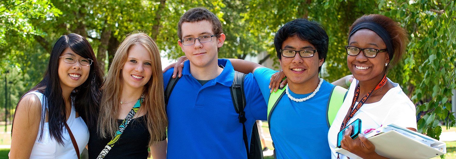 students grouped together for a photo in the campus mall