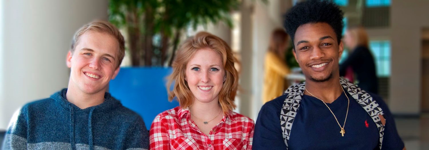 Three smiling students