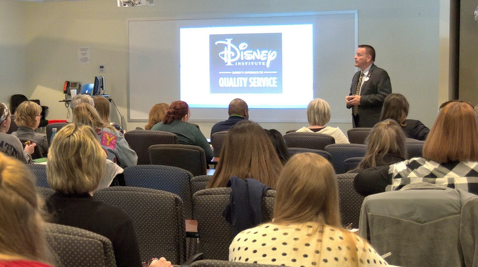 A disney institute instructor lecturing on quality service