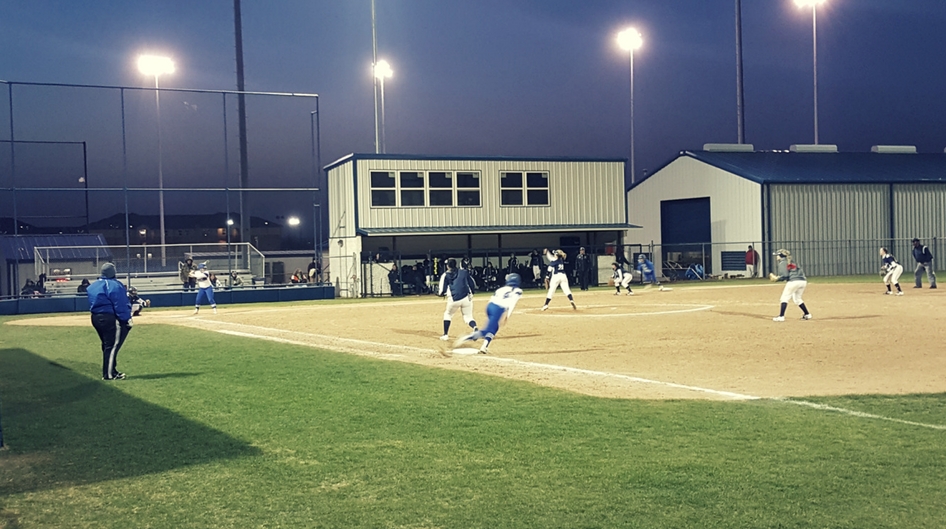 An evening softball game at Rose State College