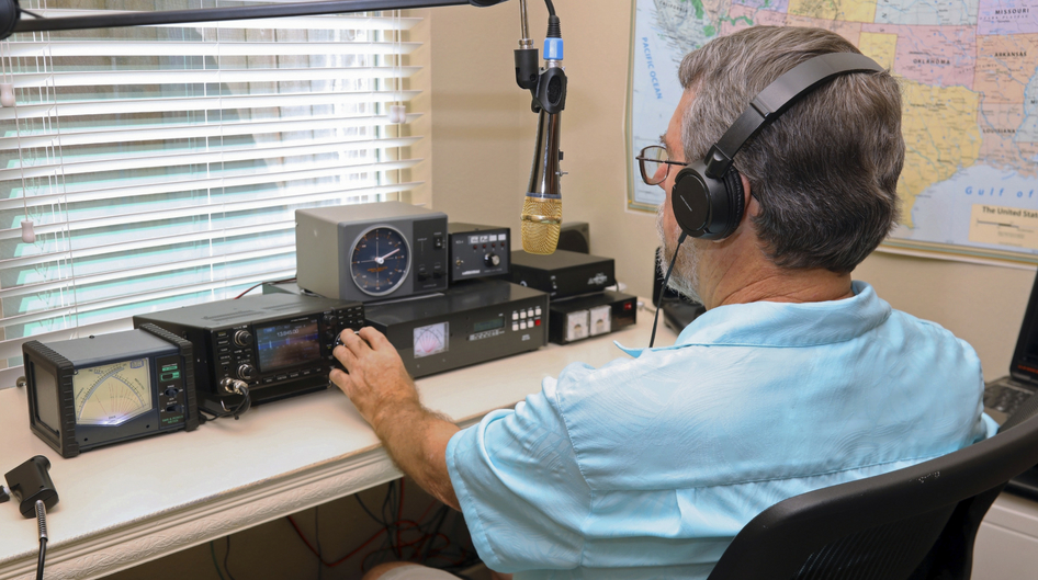 amateur radio operator at his radio