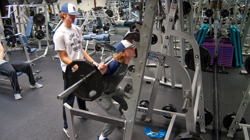 Students lifting weights