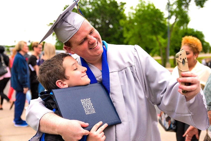 happy graduate and son